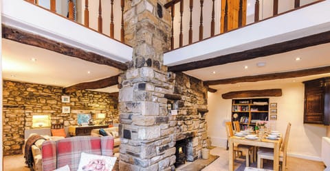 A bright and welcoming living room with comfortable seating, soft lighting, and a warm, inviting atmosphere perfect for relaxing or entertaining guests.