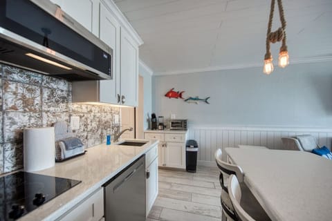 Keurig, Blender, and Toaster Oven which now has Hanging Shelves above them