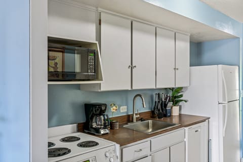 Prepare meals in comfort with modern appliances and a cozy, coastal vibe