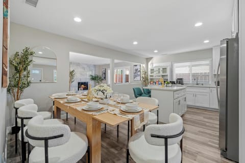 Roomy dining setup with a kitchen island for added convenience.