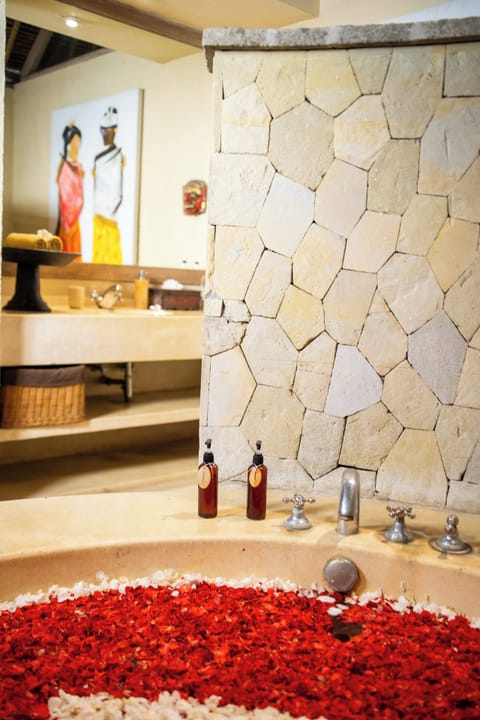 Separate tub and shower, towels, soap, shampoo