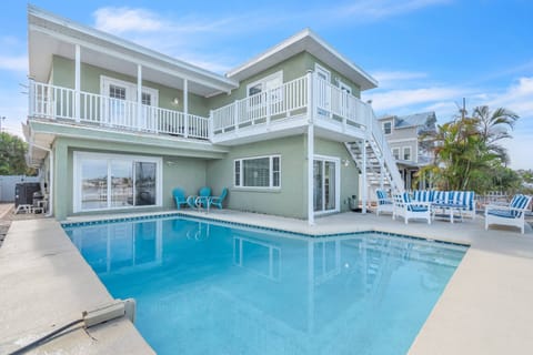 Enjoy the privacy of the waterfront heated pool with seating area