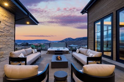 Sunset patio with a private hot tub, fire pit, and sweeping Park City mountain views.