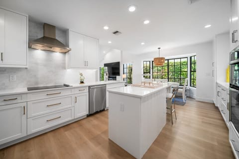 Fully stocked kitchen with bar stool seating and breakfast nook