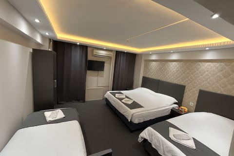 Premium Quadruple Room | Minibar, soundproofing, free cribs/infant beds, free WiFi