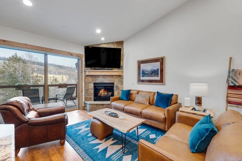 Cozy Living Room with Fireplace and TV
