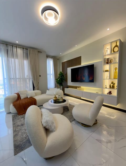 Deluxe Apartment, Balcony, City View | Living area | Flat-screen TV