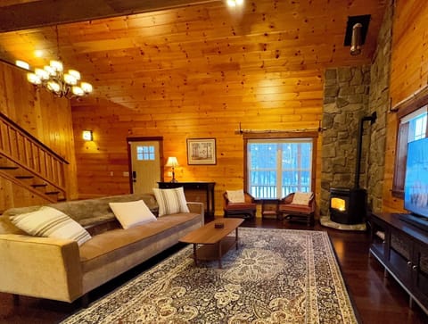Spacious, warm living room for relaxing after a busy day in Rangeley.