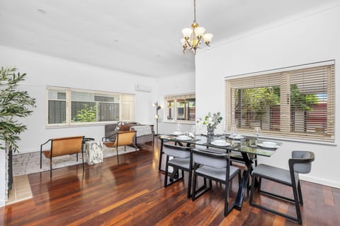 Welcome to the heart of the home! The dining area flows seamlessly into the comfortable living space, making entertaining and socializing effortless.