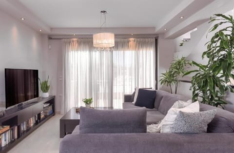 City House, 3 Bedrooms, City View | Living area | 55-inch Smart TV with satellite channels
