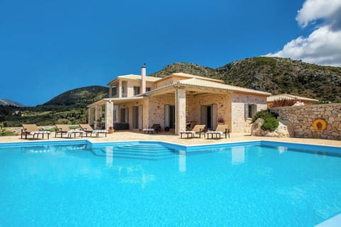 The inviting pool with the handsome villa in the background.