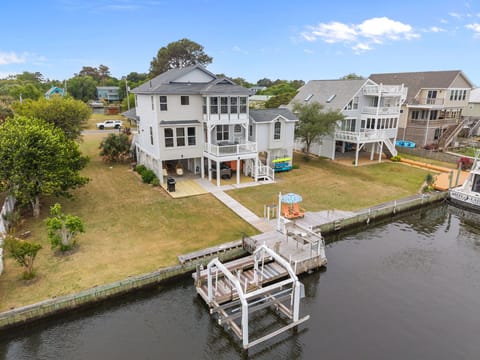 Back of house with 100' of bulkhead water access to tie your boat up