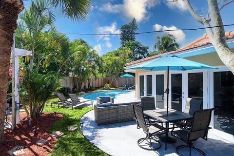 Make a splash! 💦 Our vacation rental features a sparkling private pool surrounded by lush palms and comfortable lounge chairs. The ultimate tropical getaway for families and friends.
