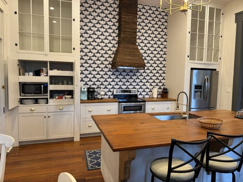 Keurig and drip coffee makers with coffee, sweetners, and creamers.