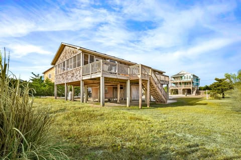 Down By The Dunes is a charming soundside home perfectly situated between the Pamlico Sound and the Atlantic Ocean.