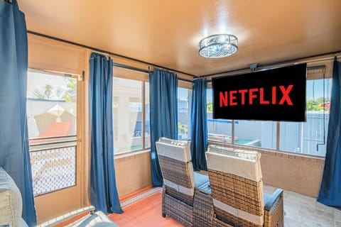 Cozy outdoor theater with six recliners, perfect for backyard movie nights