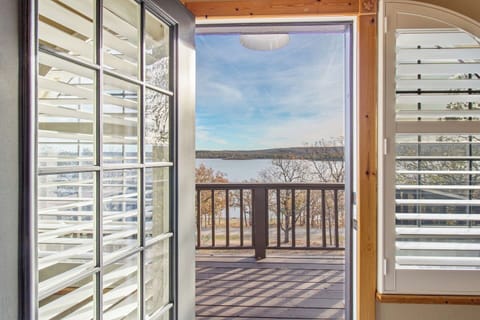 You open the door from the primary loft and the lake is waiting.