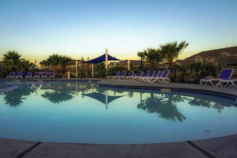 Sunset views over the resort pool and desert landscape