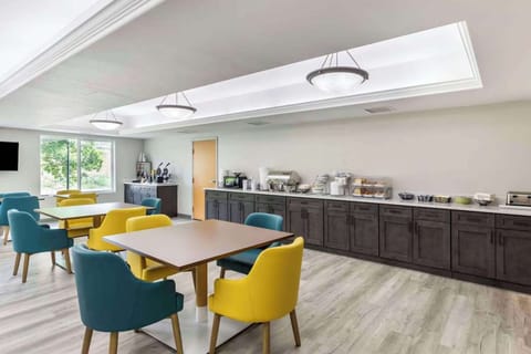 Dining room with colorful chairs and long breakfast counter