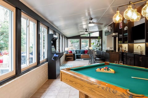 Group gatherings  made easy with pool table, 2 person arcade and wet bar.