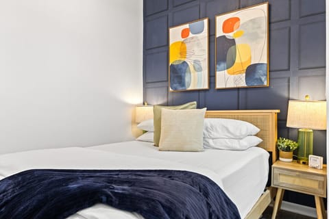 We designed the room with eye-catching wallpaper and modern artwork to create a warm, inviting vibe.