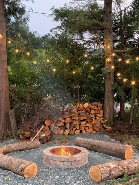 Outdoor fire pit with log seating 