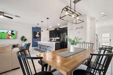 Gather around this warm, inviting dining table where meals turn into memories. Perfect for family dinners or game nights with friends, this cozy space brings everyone together with a touch of charm and joy.