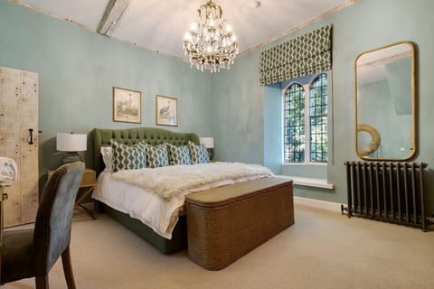 A super-king size bedroom at The Priory Retreat, Essex