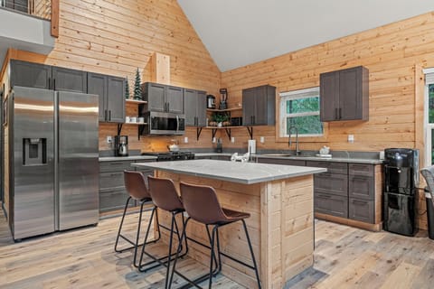 Modern kitchen with island seating and full-size appliances