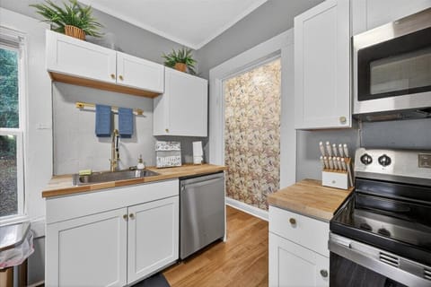 Kitchen w full size stainless steel appliances, utensils, pots &amp; pans, microwave, coffee pot (bring your favorite coffee).