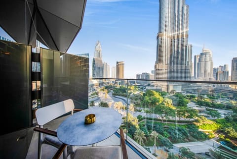 Elegant private balcony with breathtaking skyline and lush greenery views.