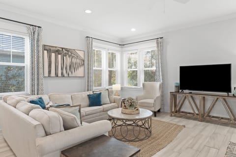 Bright and cozy living area with coastal decor.
