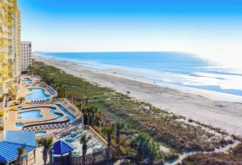 Beach Access: Just steps from your door — toes in the sand in minutes. Imagine making up and being able to walk out on your balcony, coffee, and hand watching the sunrise over the ocean. 