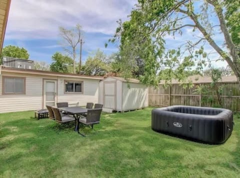 Backyard Oasis & Hot Tub: Enjoy our private, fenced backyard featuring a premium hot tub, outdoor dining, and our unique speakeasy. Note: Hot tub is used at own risk;