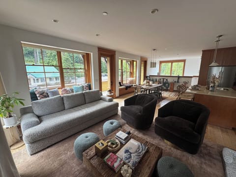 Open floor plan showing living room, dining area, and full kitchen