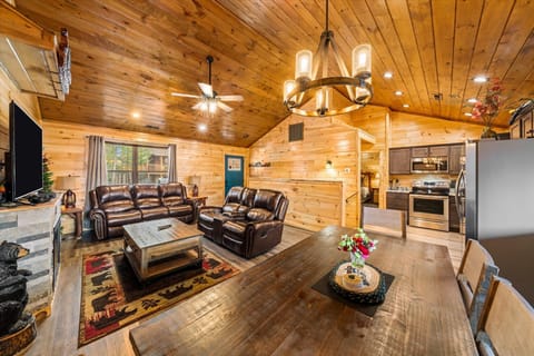 In living room, facing toward front door, open kitchen