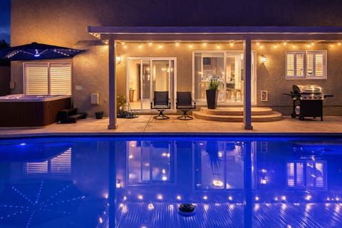Private pool & spa with string lights, BBQ, outdoor dining & lounge seating