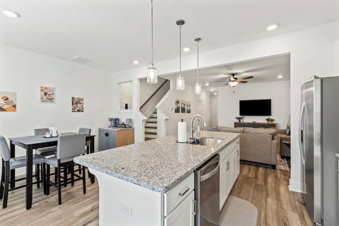 Kitchen with view of dining area and living room