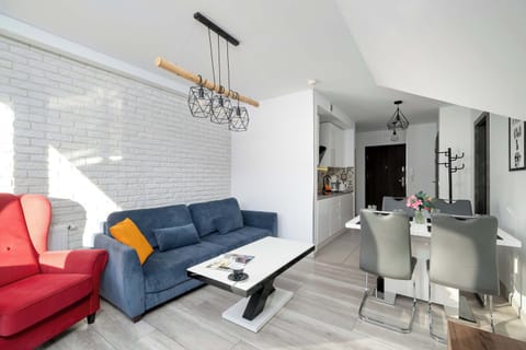 Relax in the stylish living room with a comfortable sofa and modern decor.