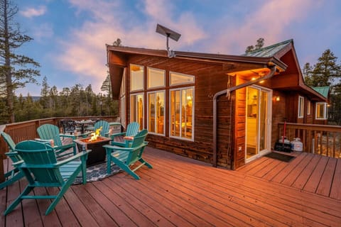Spacious wraparound deck with Adirondack seating, propane fire pit, and peaceful forest views—perfect for sunsets, stargazing, and après-ski hangs. Enjoy fresh mountain air and cozy evenings after exploring Breckenridge, Fairplay, and nearby trails.