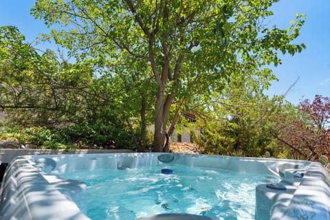 Enjoy soaking in the hot tub in a peaceful setting