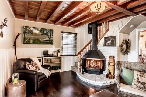 Welcoming entry with rustic charm and a cozy wood burning fireplace