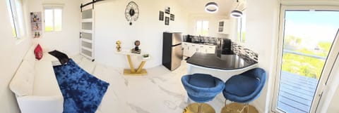 Pano view of the kitchen and living room area. Note the 50" TV is in the MBR.