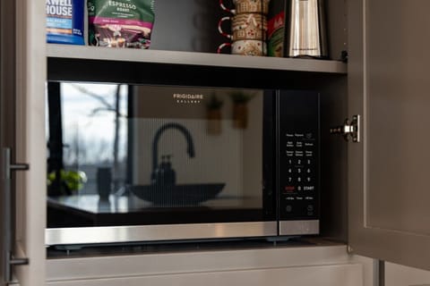 Fully equipped kitchen includes a built-in microwave, making quick snacks and meal prep easy for the whole family.