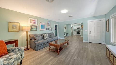 The open living room invites you to kick back under vaulted ceilings that make the whole space feel light and breezy.