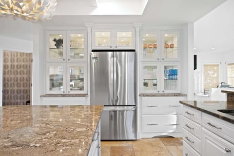 Consider this your official invitation to sip, snack, and socialize. This kitchen is the heart of the home.