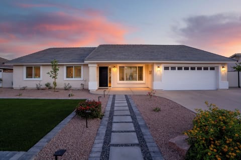 Casa Lynwood glowing at dusk — a warm welcome every time you arrive