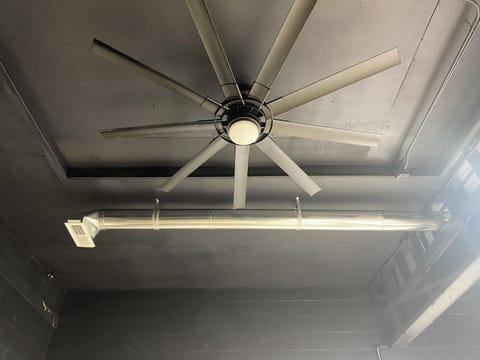 96" ceiling fan, high industrial ceilings with open pipe heating & cooling.