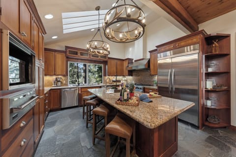 A chef-ready kitchen with granite counters, pro-grade appliances, and skylight views — perfect for cooking together after a day on the mountain.