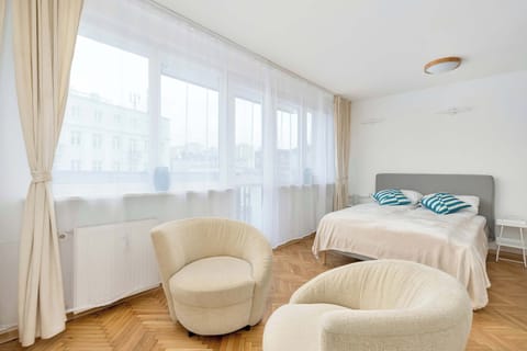 The cosy bedroom features a luxurious double bed and ample storage.
